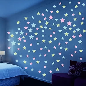 Glowing star-shaped lights on a blue wall in a bedroom setting.